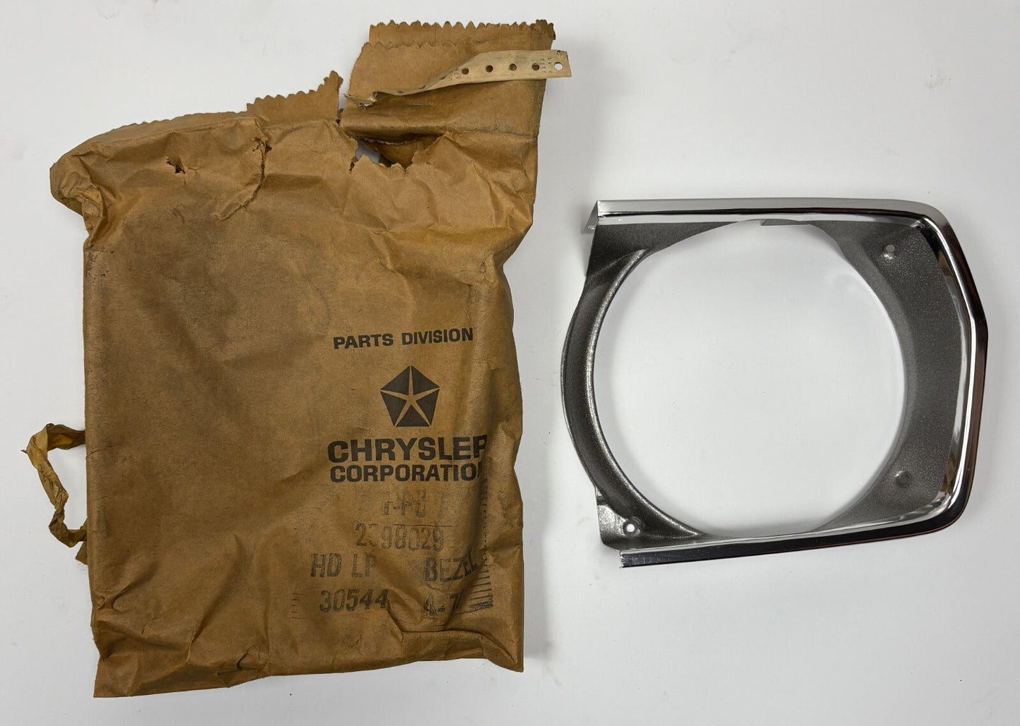 New Old Stock Left Headlight Bezel for 1970 Plymouth Models Mopar #2998029