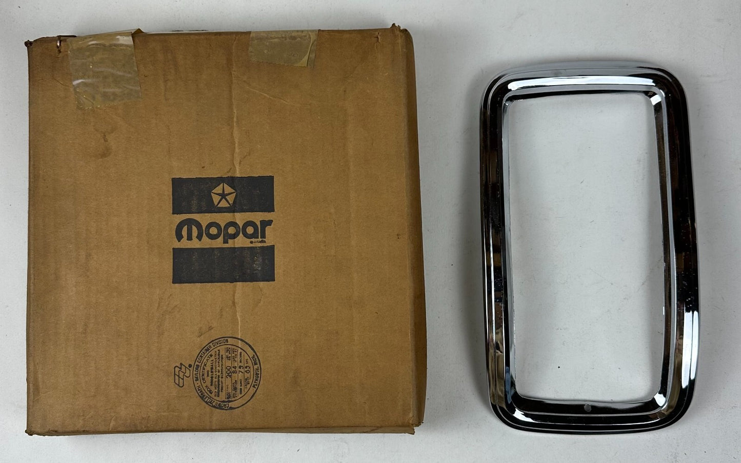 New Old Stock Left Tail Bezel for 1971-1977 Dodge Models Mopar #2956817