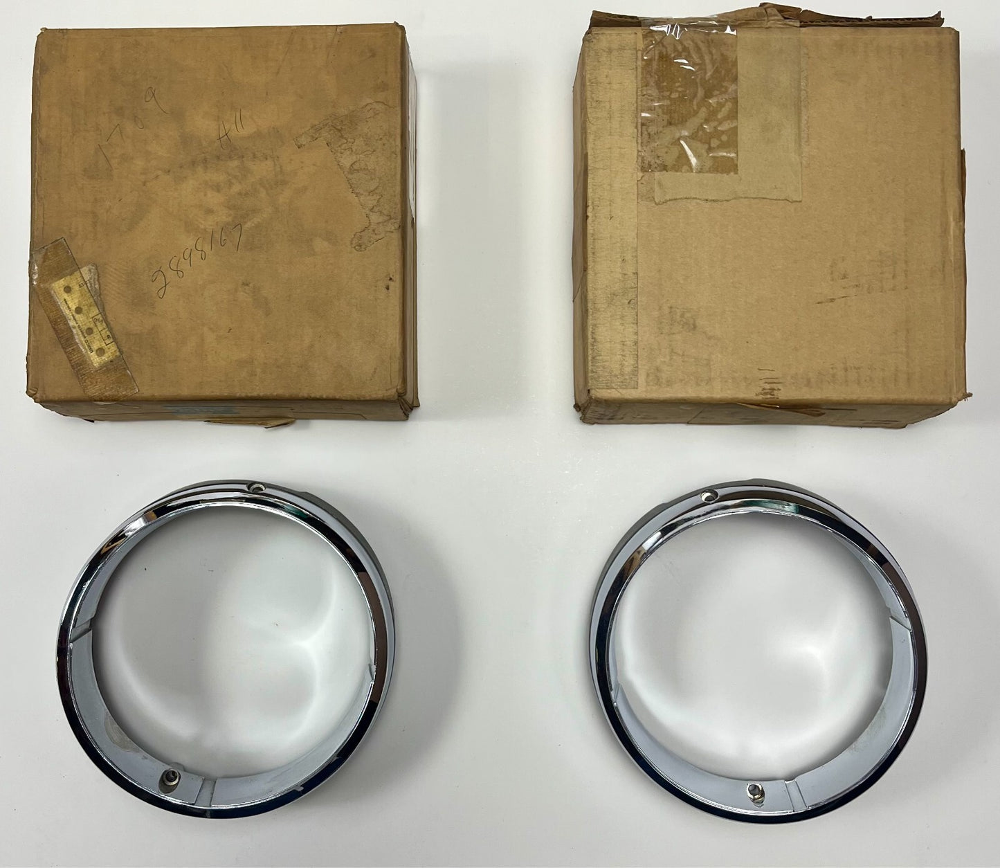 New Old Stock Headlight Bezels for 1969 New Yorker Mopar #2898166 & #2898167
