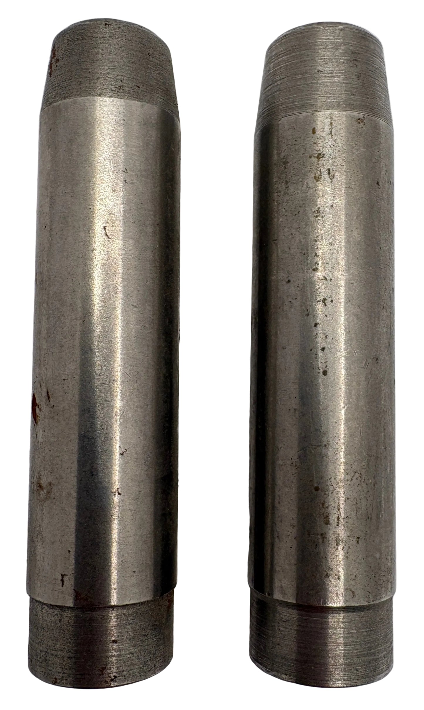 Two metallic cylindrical objects on a white background