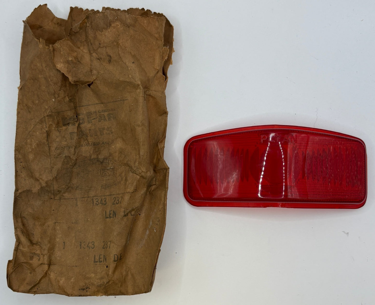 New Old Stock Red Lens Insert for 1950-52 Plymouth 3 Passenger Coupe #1343237
