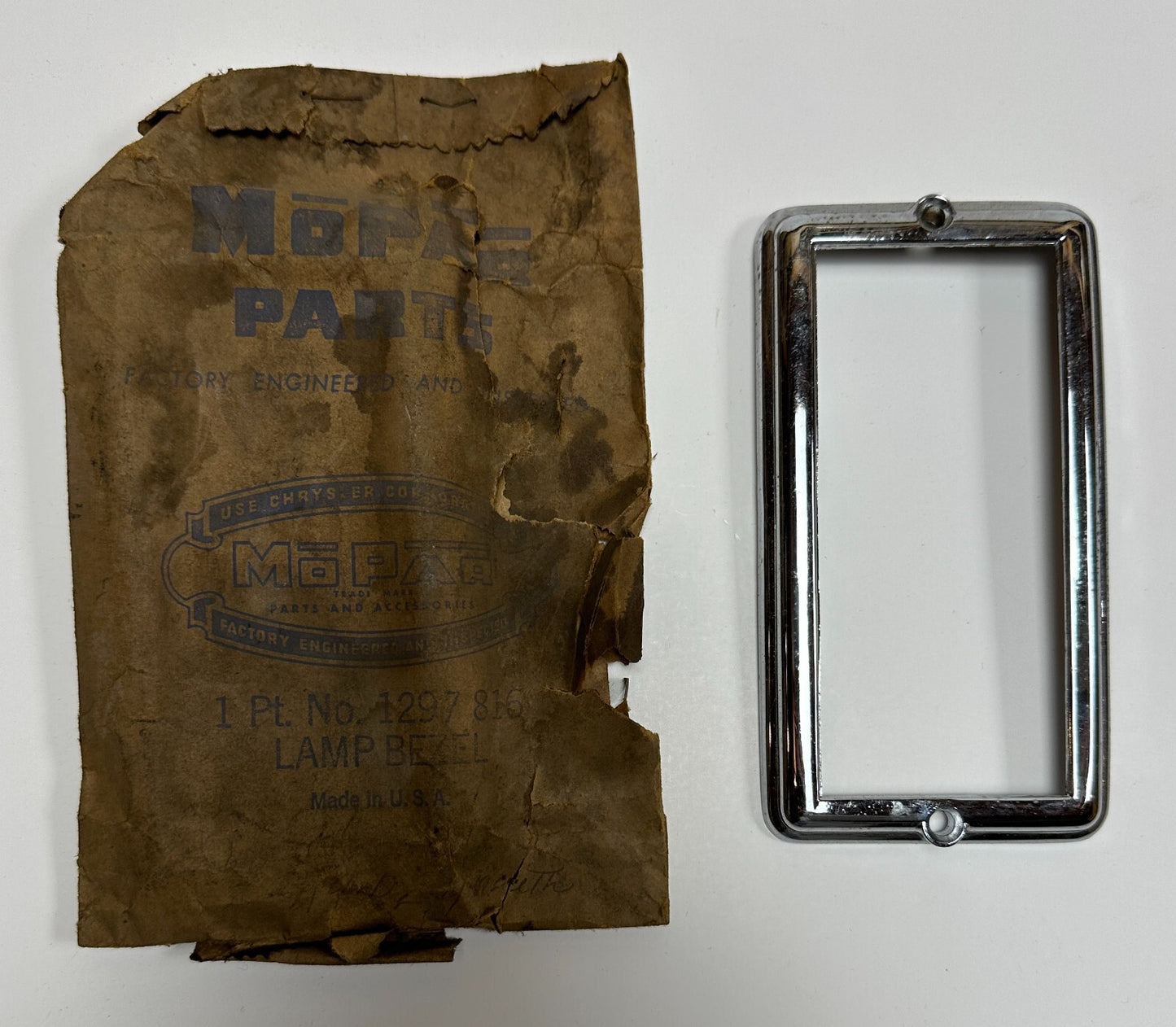 New Old Stock Left Park Lamp Bezel for 1949 Plymouth Models Mopar #1297816