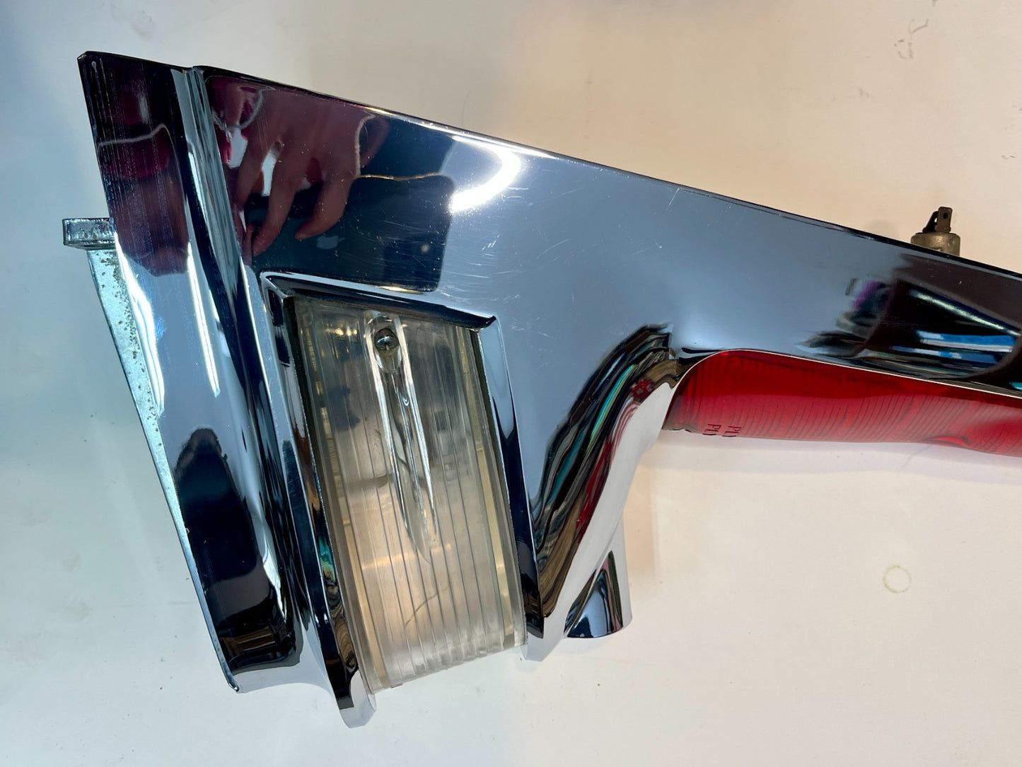 New Old Stock Left Taillamp Assy. Chrome bezel for 1960 Fury Wagons #1960886