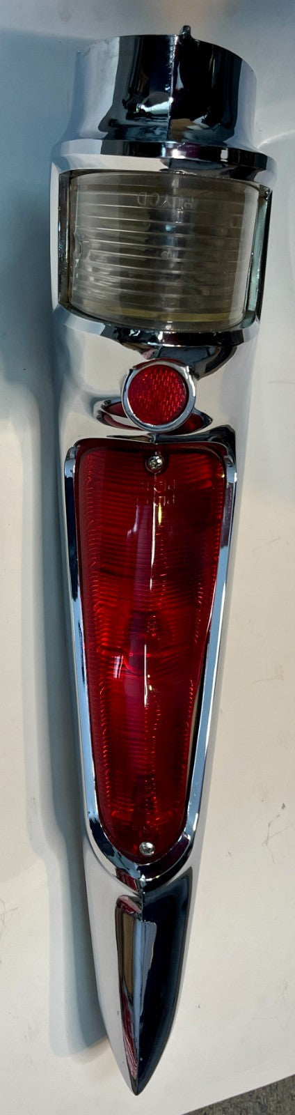 New Old Stock Left Taillamp Assy. Chrome bezel for 1960 Fury Wagons #1960886