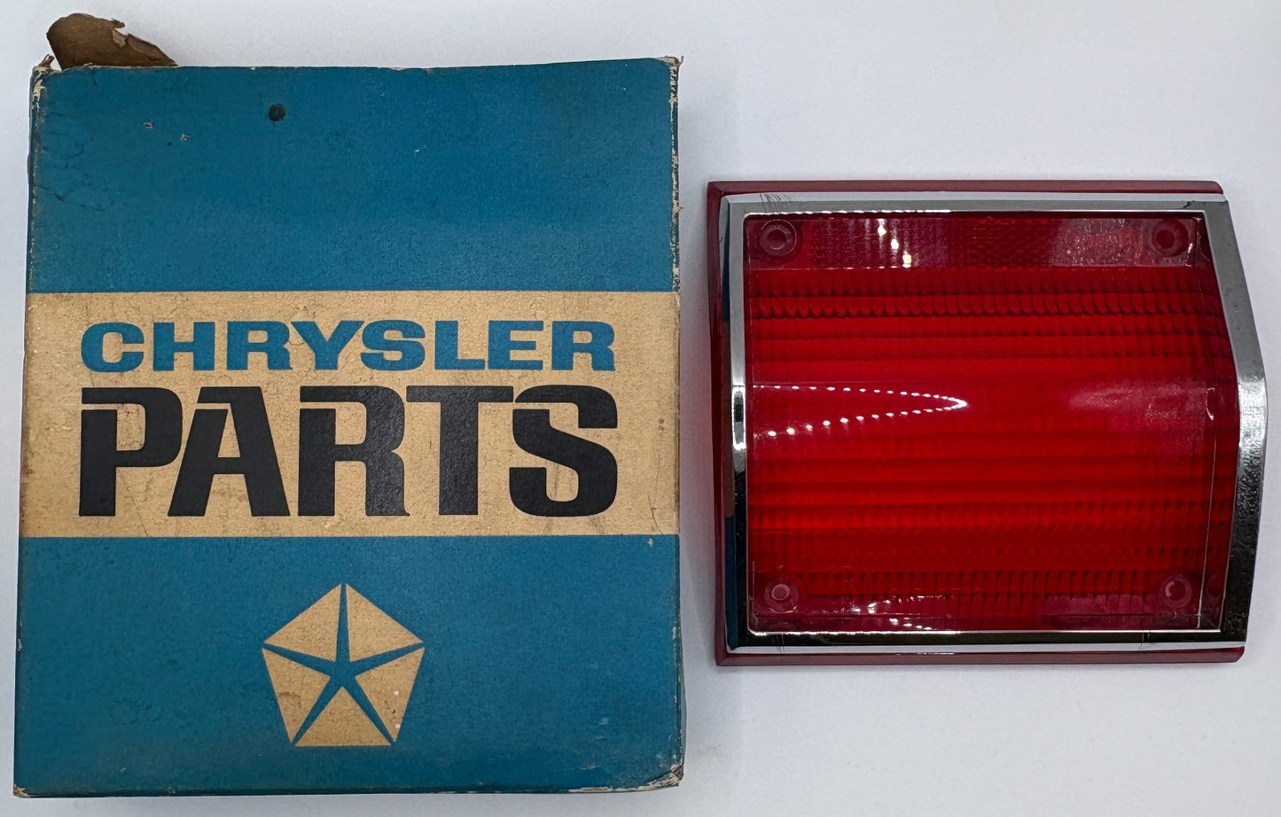 New Old Stock Tail Light Lens w/ Chrome Bezel for 1965 Plymouth Fury #2449696