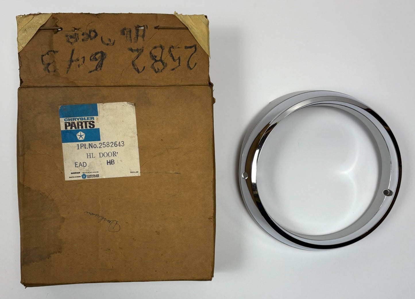 New Old Stock Left Outer Headlight Bezel for 1967 Chrysler Models Mopar #2582643