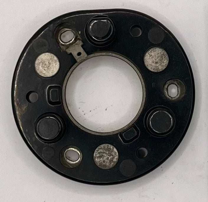 Black mechanical component next to a Mopar box on a white background