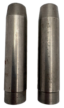 Two metallic cylindrical objects on a white background